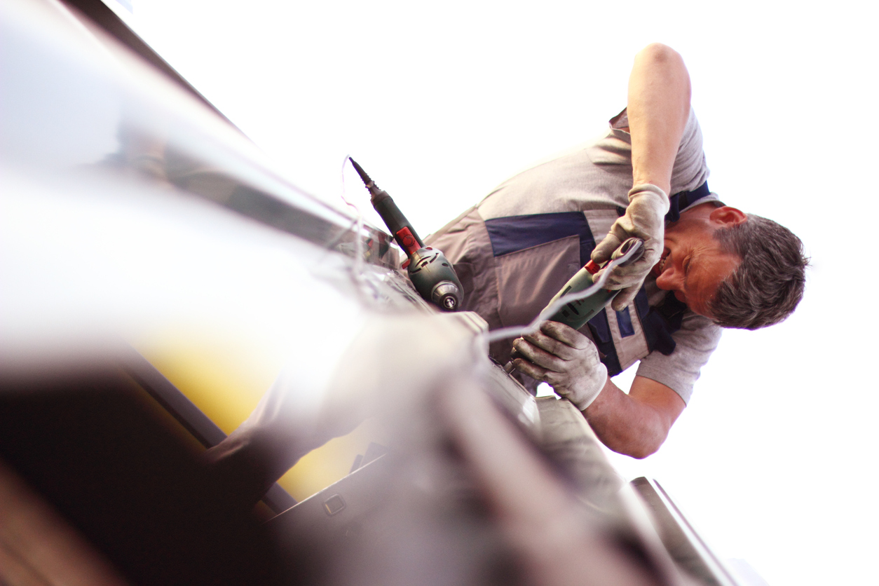 man conducting roof repairs